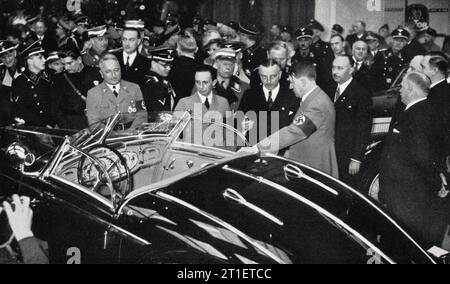 Dr. JOSEPH GOEBBELS Dr. ROBERT LEY (and behind him Italian Workmen's Leader Signor TULLIO CIANETTI ) and ADOLF HITLER visiting the INTERNATIONALE AUTOMOBIL  UND MOTORRAD AUSTELLUNG / INTERNATIONAL CAR AND MOTORCYCLE EXHIBITION in Berlin Germany which ran from 20th February to 7th March 1937 Stock Photo