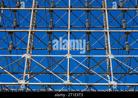 Overhead High Voltage Electrical Power Transmission Cables And Insulators On An Pylon (Transmission Tower) Stock Photo