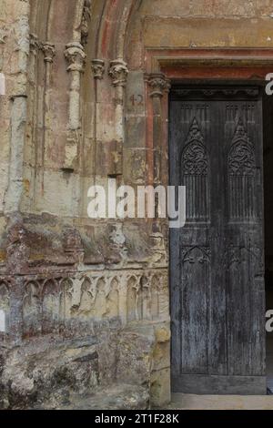 Angers, France, 2023. In the Château d'Angers, the beautifully carved wooden door of the 15th century chapel dedicated to John the Baptist Stock Photo