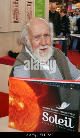 Paris, France. 13th Oct, 2023. File photo - Scientist Hubert Reeves poses with his book during the final day of Paris Book Fair 'Le Salon Du Livre' held at Porte de Versailles in Paris, France, on March 27, 2007. - Canadian-French astrophysicist Hubert Reeves, who was renowned for his work popularizing space science, died Friday aged 91. Photo by Denis Guignebourg/ABACAPRESS.COM Credit: Abaca Press/Alamy Live News Stock Photo