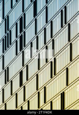 Architectural abstract of colorful reflections off glass windows of modern building from Captain John's Pier along the waterfront in downtown Toronto Stock Photo
