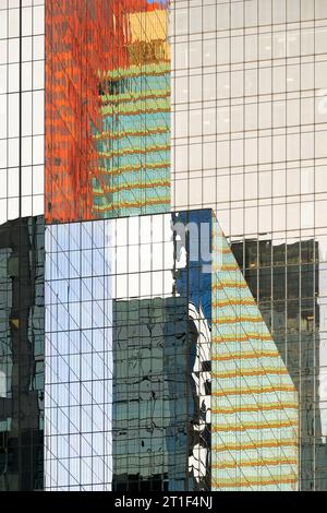 Architectural abstract of colorful reflections off glass walls of modern skyscrapers on Adelaide Street in downtown Toronto, Ontario Stock Photo