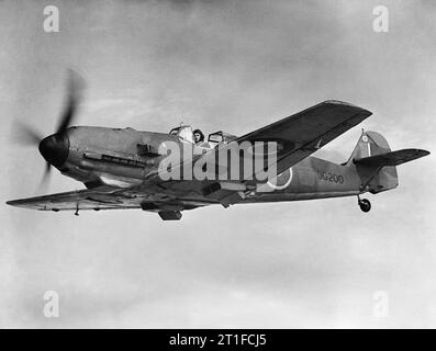 Ministry of Aircraft Production Second World War Official Collection Captured Messerschmitt Bf 109E-3, DG200, in flight while serving with No. 1426 (Enemy Aircraft) Flight. Formerly 'Black 12' of 2/JG51, this aircraft force-landed at Manston, Kent, on 27 November 1940, after being attacked by Supermarine Spitfires of No. 66 Squadron RAF over the Thames estuary. After repair at the Royal Aircraft Establishment it was delivered to Rolls-Royce Ltd at Hucknall in February 1941 for engine performance tests. On 8 February 1942 it was passed to the Controller of Research and Development at Hatfield f Stock Photo