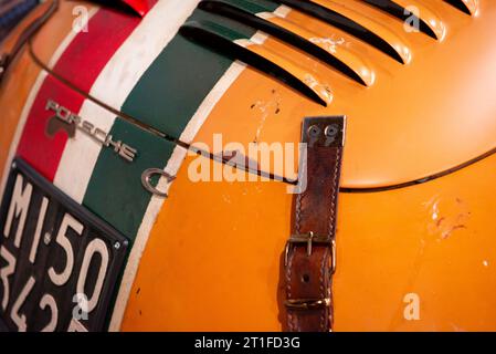Leather hood or bonnet strap on orange Porsche 356 C 1600 racing car from 1964 with Italian number plate Stock Photo
