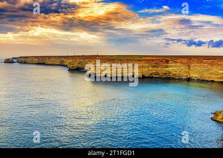Dramatic evening seascape overlooking a high steep shore Stock Photo