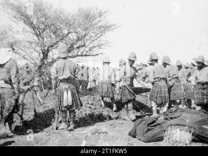 General Kitchener and the Anglo-egyptian Nile Campaign, 1898 Soldiers of the Cameron Highlanders and Seaforth Highlanders dig graves in order to bury their dead after the Battle of Atbara. The British Brigade (composed of Royal Warwicks, Lincolns, Seaforths and Camerons) lost five officers and 21 men in the action while the Egyptian Brigade lost 57. The losses of the Sudanese (Dervish) forces led by Emir Mahmoud were estimated at 3000 or more. Stock Photo