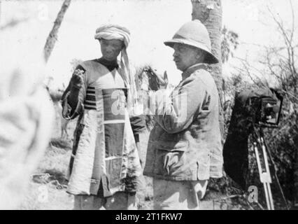 General Kitchener and the Anglo-egyptian Nile Campaign, 1898 The defeated leader of the Sudanese (Dervish) forces at the Battle of Atbara, Emir Mahmoud, is interrogated by Director of Military Intelligence, Colonel Sir Francis Wingate after being captured. Note the camera mounted on a tripod in the background. Stock Photo