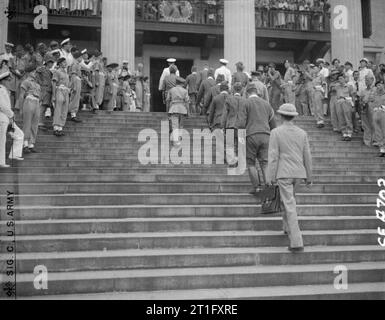 The Japanese Southern Armies Surrender at Singapore, 1945 The Japanese delegation and their escort mount the steps of the Municipal Building in Singapore on their way to sign the formal document of surrender. Stock Photo