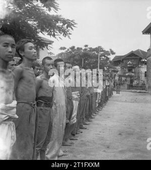 Japanese prisoners of war line up for roll call in Rangoon during the ...