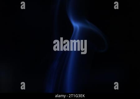 Blue line, blue smoke on a dark background, colourful abstract, blue fog, minimalism, line of light Stock Photo