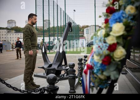 Odesa, Ukraine. 13th Oct, 2023. Ukrainian President Volodymyr Zelenskyy stands for a moment of silence during a wreath ceremony with Dutch Prime Minister Mark Rutte at a memorial to Ukrainian sailors lost in the Russian Invasion at marine terminal of Odesa sea port, October 13, 2023 in Odesa, Ukraine. Credit: Ukraine Presidency/Ukrainian Presidential Press Office/Alamy Live News Stock Photo