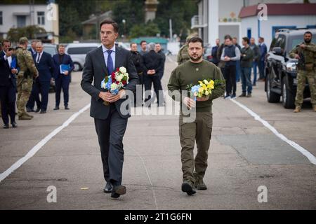 Odesa, Ukraine. 13th Oct, 2023. Ukrainian President Volodymyr Zelenskyy, right, and Dutch Prime Minister Mark Rutte, left, during a wreath ceremony at a memorial to Ukrainian sailors lost in the Russian Invasion at marine terminal of Odesa sea port, October 13, 2023 in Odesa, Ukraine. Credit: Ukraine Presidency/Ukrainian Presidential Press Office/Alamy Live News Stock Photo