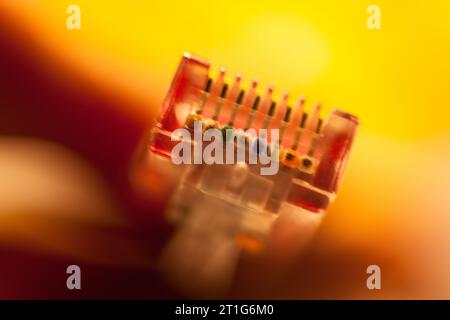 Fingers holding a network cat 5 cable Stock Photo