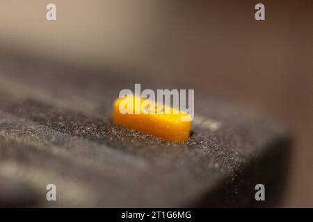 The corner edge of a remote control and its power on/off button Stock Photo