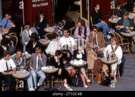 Young people at outdoor cafe in Paris, France, Europe Stock Photo