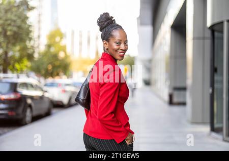 Confident mature woman walking in the city Stock Photo