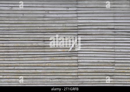 Old aged weathered natural grey damaged wooden farm shack wall texture, large detailed textured rustic grungy horizontal background closeup Stock Photo