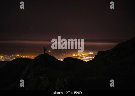 Silhouette of a young man on the mount of Aiako Harria in Oiartzun. Basque Country Stock Photo