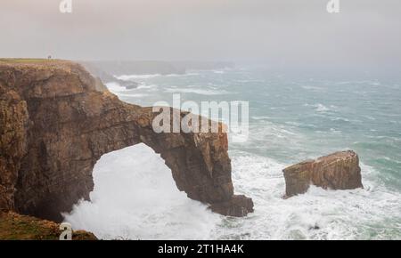 The Green bridge of Wales on the Pembrokeshire coast UK during storm Agnes Stock Photo