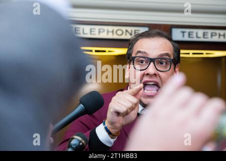 Washington, United States. 13th Oct, 2023. United States Representative George Santos (Republican of New York) yells to the press about Israel in the midst of a GOP caucus meeting to declare a GOP nomination for the Speaker of the House in the Longworth House Office Building on Friday, October 13, 2023. Kevin McCarthy (Republican of California) was recently ousted from the Speakership. Photo by Annabelle Gordon/CNP/ABACAPRESS.COM Credit: Abaca Press/Alamy Live News Stock Photo