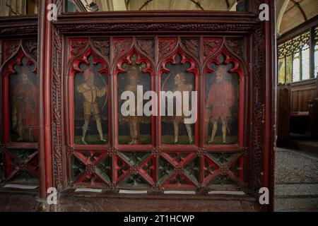 15th century painted panels on rood screen, St Peter's Church, Ugborough, Devon, England, UK Stock Photo
