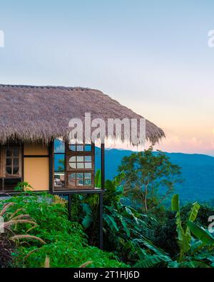 Homestay in the Doi Chang mountains of Chiang Rai Northern Thailand, bamboo wooden hut in the mountains, cottage cabin at sunset Stock Photo