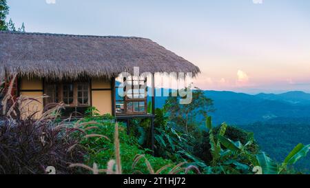 Homestay in the Doi Chang mountains of Chiang Rai Northern Thailand, bamboo wooden hut in the mountains, cottage cabin at sunset Stock Photo