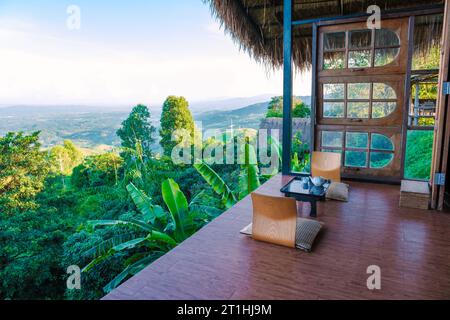 Homestay in the Doi Chang mountains of Chiang Rai Northern Thailand, bamboo wooden hut in the mountains, cottage cabin at sunset in the mountains of Northern Thailand Stock Photo