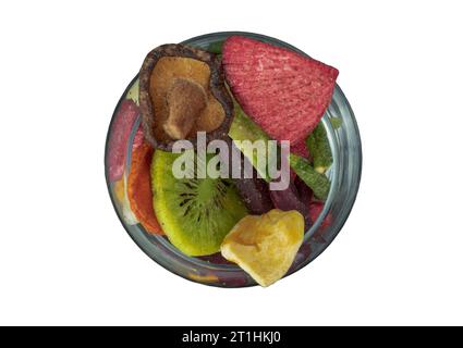 Crispy mixed veggies and fruits in the glass isolated on white background with clipping path. Different colorful dried fruits and vegetables, Healthy Stock Photo