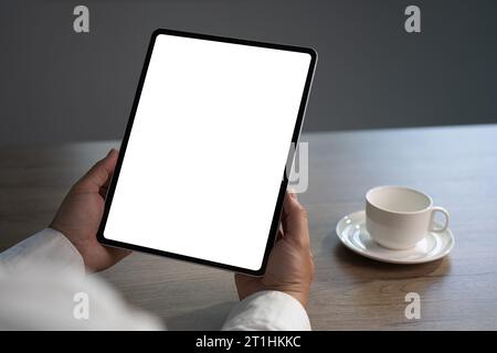 Digital tablet computer close up man using tablet hands man multitasking with isolated screen Stock Photo