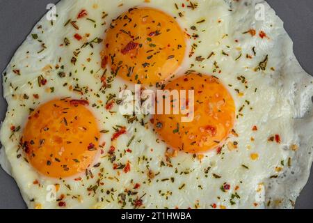 scrambled eggs with spices on a gray plate top view close up Stock Photo
