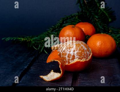 mandarins on a dark blurred background Stock Photo