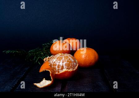 mandarins on a dark blurred background Stock Photo