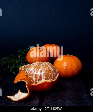 mandarins on a dark blurred background Stock Photo