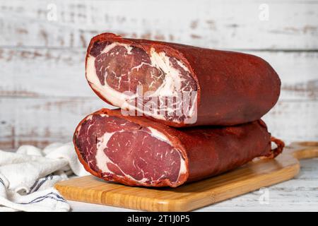 Beef pastrami. Kayseri beef pastrami on wooden background Stock Photo