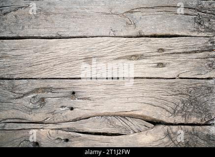 Background texture of grunge weathered vintage grey knotty wooden planks Stock Photo
