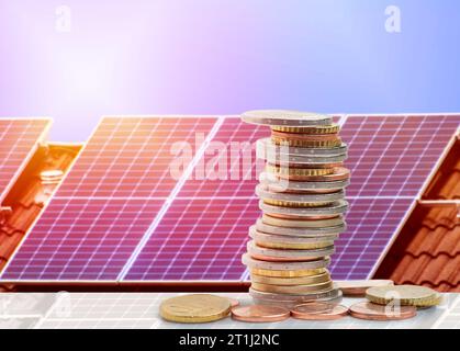 Money saved by using energy with solar panel on the roof at home Stock Photo