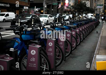 New York,  New York state  USA - August, 30, 2023 - Row of blue Citi Bikes parked into the charging station in Brooklyn, NY Stock Photo