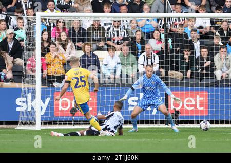 Louis Reed of Mansfield Town scores the opener to make it 1-0 during ...
