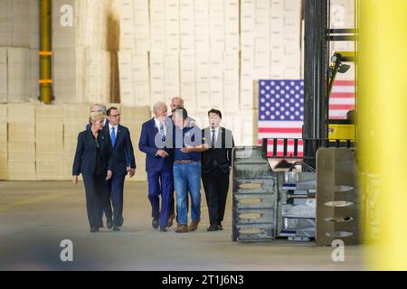 Philadelphia, United States. 13th Oct, 2023. U.S. President Joe Biden, center, walks with union workers and company executives announcing funding for regional clean energy hubs during an event at the at Tioga Marine Terminal, October 13, 2023 in Philadelphia, Pennsylvania. Credit: Adam Schultz/White House Photo/Alamy Live News Stock Photo