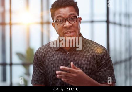 Indoor shot of a young confident black businessman looking serious Stock Photo