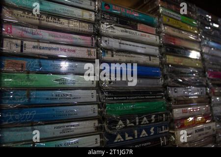 Bantul, Yogyakarta, Indonesia. 14th Oct, 2023. Physical album recordings in cassette format are displayed in a music shop called Toko Musik Luwes in Bantul. According to data released by the Recording Industry Association of America (RIAA), music revenues are increasing, driven primarily by streaming services but also by sales of physical music formats. The report found that revenues from physical music formats have gradually increased over the years. Overall physical music revenue rose 4 percent last year, driven by a 17 percent increase in vinyl records. Physical releases of music continue Stock Photo