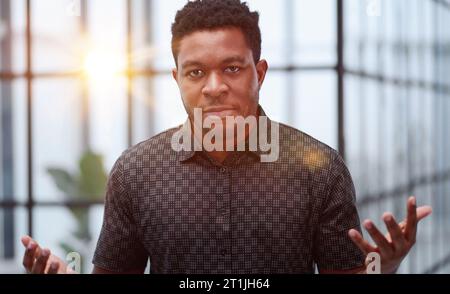 People and lifestyle. Indoor shot of a young confident black businessman looking serious Stock Photo