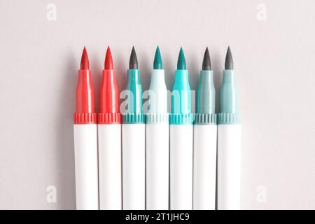 Small set of opened felt-tip pens, turquoise pink colors. Painting, arts, hobby and leisure activity template. Copy space for text Stock Photo