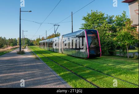 Tours, Loire Valley, France - September 3, 2023: Modern tram in Tours in a green area at the end of the line, designed by Tours-based French design ho Stock Photo