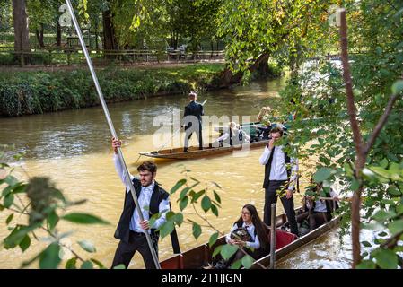 Oxford, UK, 14th October 2023. Oxford University Freshers in white tie and gowns take to the River Cherwell after their Matriculation ceremony. Credit: Martin Anderson/Alamy Live News Stock Photo