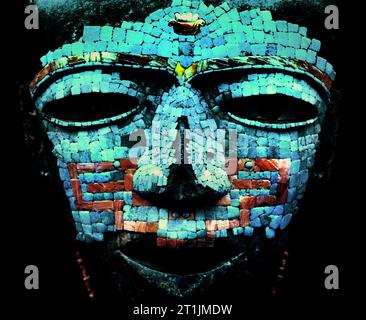 Funeral mask covered by turquoise and red shell mosaic. Artifact from Teotihuacan, Mexico City. Stock Photo