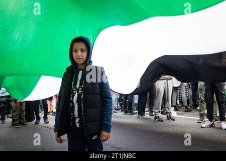 London, UK, October 14, 2023. A protest proceeding from the BBC to Downing Street, supporting the Palestinian cause in the Hamas-Israel conflict.  (Tennessee Jones - Alamy Live News) Stock Photo