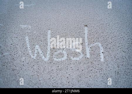 Dirty and mud stain on white car surface Stock Photo