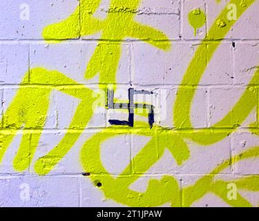 Nazi swastika symbol graffiti scrawled on a wall Stock Photo